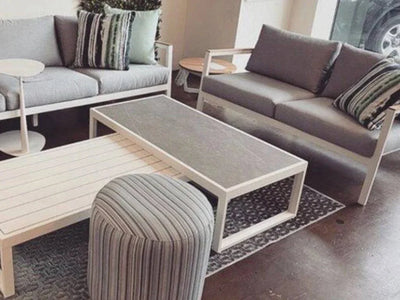 Cebu Outdoor Ceramic Coffee Table with sleek ceramic top and sturdy aluminum base in stylish outdoor lounge setting.