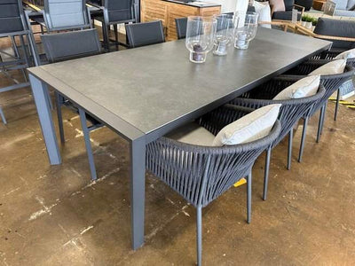 Cebu Outdoor Ceramic Dining Table with charcoal frame and ceramic top.