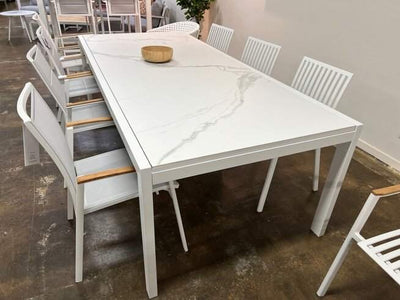 Cebu Outdoor Ceramic Extendable Dining Table with durable aluminum base and sleek white ceramic top, perfect for outdoor dining.