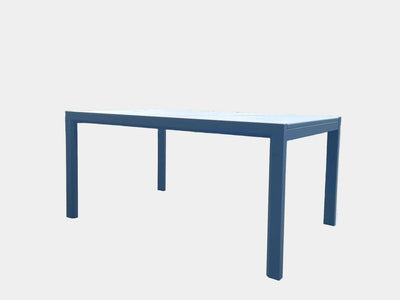 Outdoor ceramic extendable dining table with charcoal aluminum frame and white ceramic top.