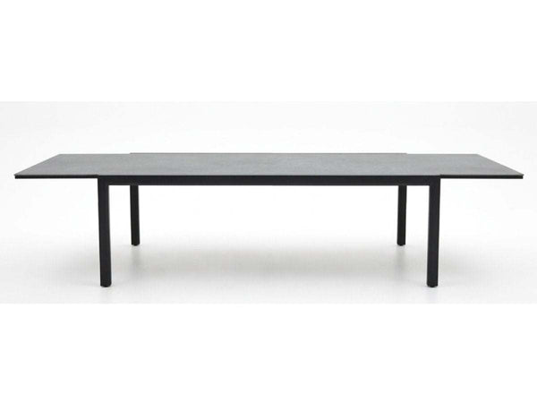 Cebu Outdoor Ceramic Extendable Dining Table - Large with black sleek ceramic top and slim black aluminium legs in extended form.
