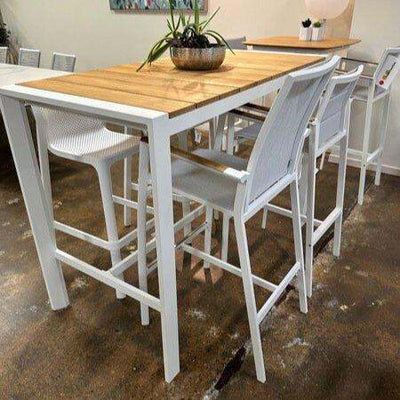 Cebu Outdoor Teak Bar Table with white aluminum base and teak top, perfect for outdoor dining and entertaining.