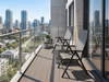 Chora outdoor multi-position high-back chairs on a modern balcony