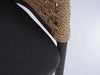 Close-up of Como Outdoor Wicker Chair showing charcoal cushion and twisted hyacinth rope weave on aluminium frame