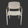 Cove Outdoor Dining Chair with white frame and wooden armrests against dark background
