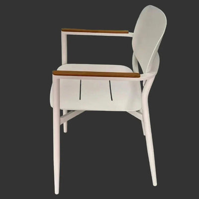 Cove Outdoor Dining Chair with white frame and wooden armrests against dark background