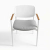 Cove Outdoor Dining Chair with aluminium frame and teak armrests in a modern outdoor patio setting