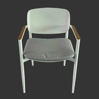Cove outdoor dining chair with white frame, wooden armrests, and gray cushion seat