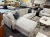 Crosby chaise lounge in light fabric with dark pillows on clearance sale in furniture store
