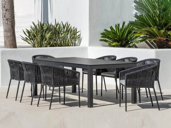 Dante Outdoor Ceramic Dining Table with heavy-duty aluminum frame and sleek ceramic top in outdoor patio setting