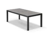 Dante Outdoor Ceramic Dining Table with charcoal frame and marble ceramic top in stylish outdoor setting