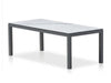 Dante Outdoor Ceramic Dining Table with aluminum frame and ceramic top in outdoor setting