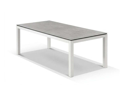 Dante Outdoor Ceramic Dining Table with heavy-duty aluminum frame and easy-to-clean ceramic top in elegant outdoor setting