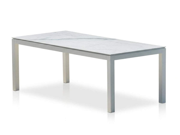 Dante Outdoor Ceramic Dining Table with heavy-duty aluminum frame and ceramic top in stylish outdoor setting