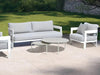 Domani Outdoor Lounge - 1 Seater Sofa with white powder-coated aluminum frame and Natte Grey Chine fabric, outdoors.