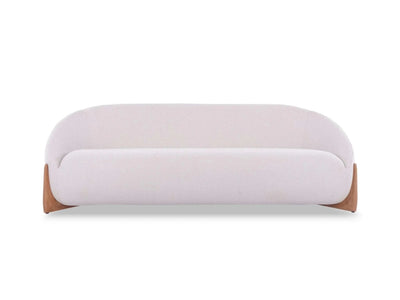 Dune 3 Seater Outdoor Sofa with curved design, teak base, and light-colored upholstery for outdoor comfort and durability