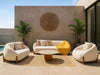 Dune 1 Seater Outdoor Sofa with curved design, teak base, and Sunbrella fabric cushions in modern patio setting