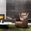 Embrace Leather Armchair in modern living room setting with fireplace.
