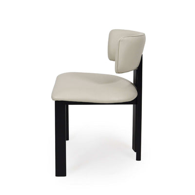 Enzo Dining Chair with black-stained oak frame and frost-coloured leather upholstery in modern dining room
