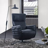 Evan Leather Armchair in a modern living room setting with a sleek design, high backrest, and sculpted armrests, ideal for relaxation and style.