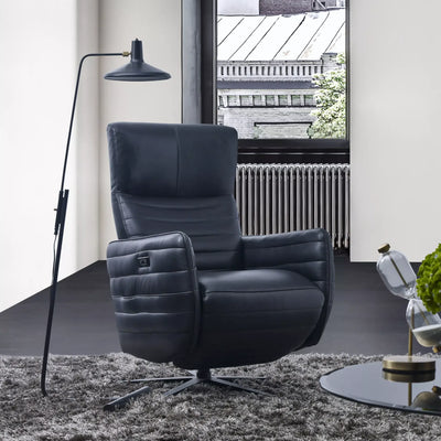 Evan Leather Armchair in a modern living room setting with a sleek design, high backrest, and sculpted armrests, ideal for relaxation and style.
