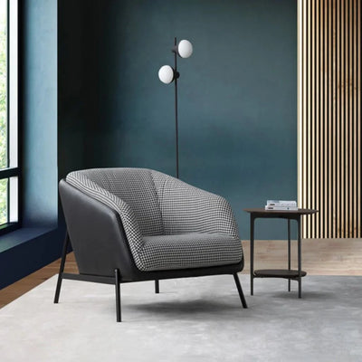 Fashion Leather Armchair in modern living room setting, featuring sleek design and checkered upholstery.