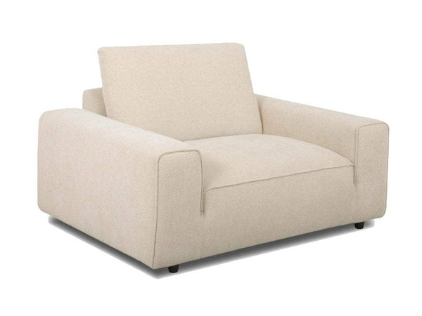 Armchair in pale beige woven fabric with broad square arms, a loose back cushion, and short dark feet; Georgia 6 Seater Corner Sofa with Chaise
