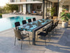Imperial Outdoor Italian Lava Stone Dining Table handcrafted from basalt with hand-painted lava stone surface and powder-coated metal frame on terrace