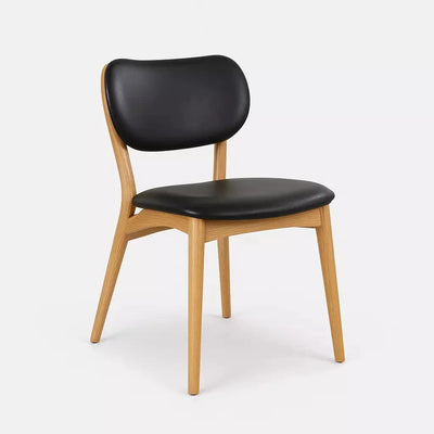 Jake Leather Dining Chair with black leather upholstery and natural timber frame.