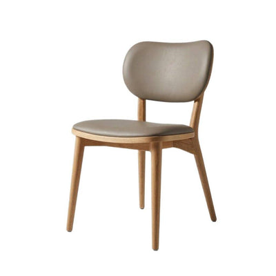 Jake Leather Dining Chair with black leather upholstery and polished rubberwood frame in mid-century modern design