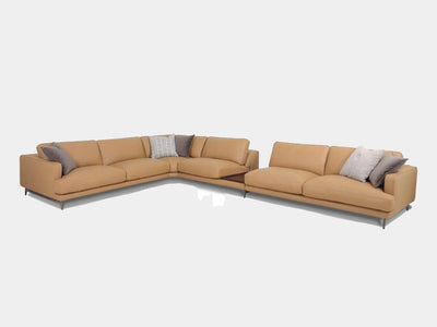 James 6.25 Seater Corner Sofa in tan leather with plush cushions and sleek metal accents, ideal for contemporary and traditional interiors.