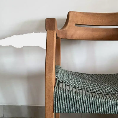Jordan Outdoor Teak Dining Chair with solid teak frame and handwoven sage green seat.