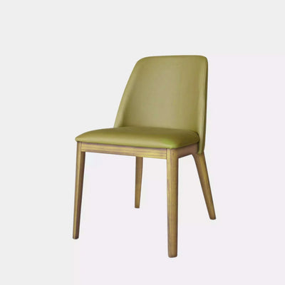 Kai Leather Dining Chair in Olive with timber legs, showcasing a timeless design suitable for various interiors.