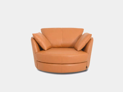 Kart Leather Armchair with curved design and plush cushions in premium leather.
