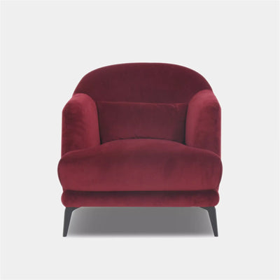 Kartik Leather Armchair in red with metal legs and lumbar pillow.
