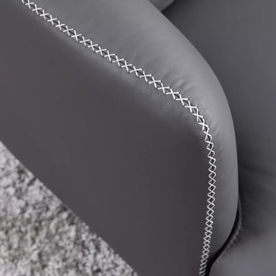 Close-up of the Kartik Leather Armchair's premium leather upholstery and tailored stitching.