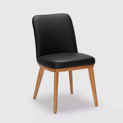 Kent Leather Dining Chair with black leather and natural timber legs.