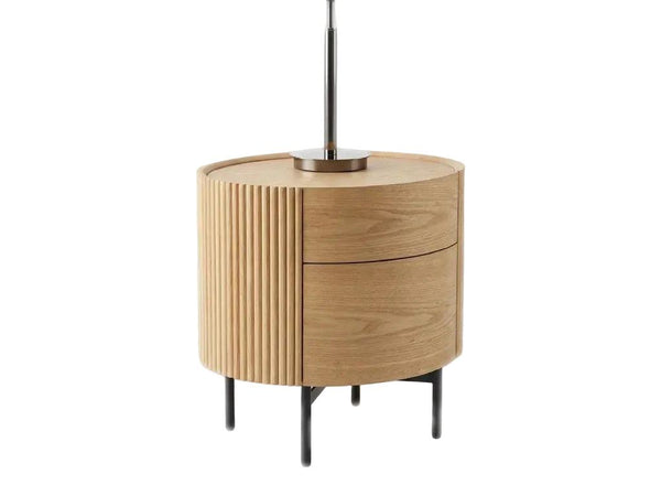 Lantone Bedside Table with ash oak veneer, slatted timber panels, two soft-close drawers, and black metal legs in modern bedroom setting