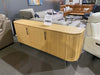 Lantone buffet in natural wood finish with Black November Sale sign at furniture showroom