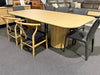 Lantone Dining Table with minimalist design in Natural Oak finish, surrounded by modern chairs.