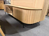 Modern Lantone TV Unit with curved design and sleek metal legs in natural oak.