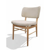 Levi Fabric Dining Chair with champagne upholstery and polished rubber wood legs, padded seat, and supportive backrest