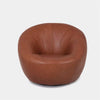Lora Leather Armchair with sculptural rounded design and premium leather upholstery.