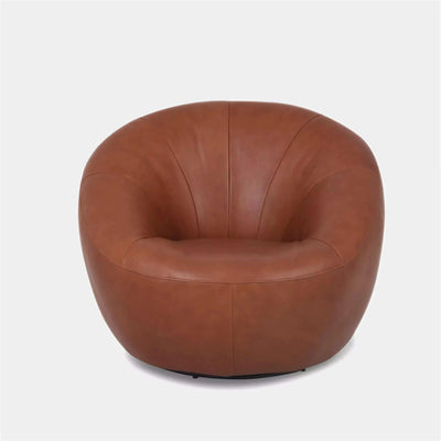Lora Leather Armchair with sculptural rounded design and premium leather upholstery.