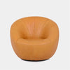 Lora Leather Armchair with sculptural rounded design in premium leather upholstery.