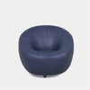Lora Leather Armchair with sculptural rounded design in dark blue leather.