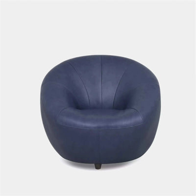 Lora Leather Armchair with sculptural rounded design in dark blue leather.