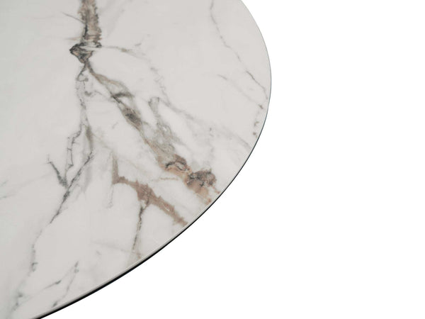 Lugo Ceramic Round Dining Table with tan marble ceramic top and black powder-coated steel base with gold trim in compact dining space