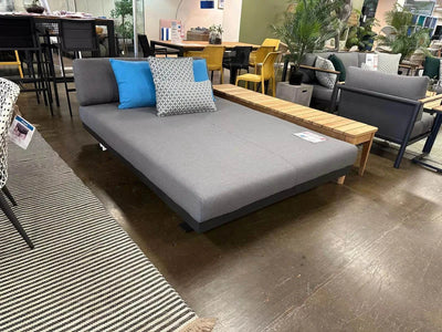 Luzon Daybed with sleek design and weather-resistant cushions in modern outdoor setting.