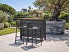 Luzon Outdoor Bar Table with teak top and built-in storage in white outdoor setting